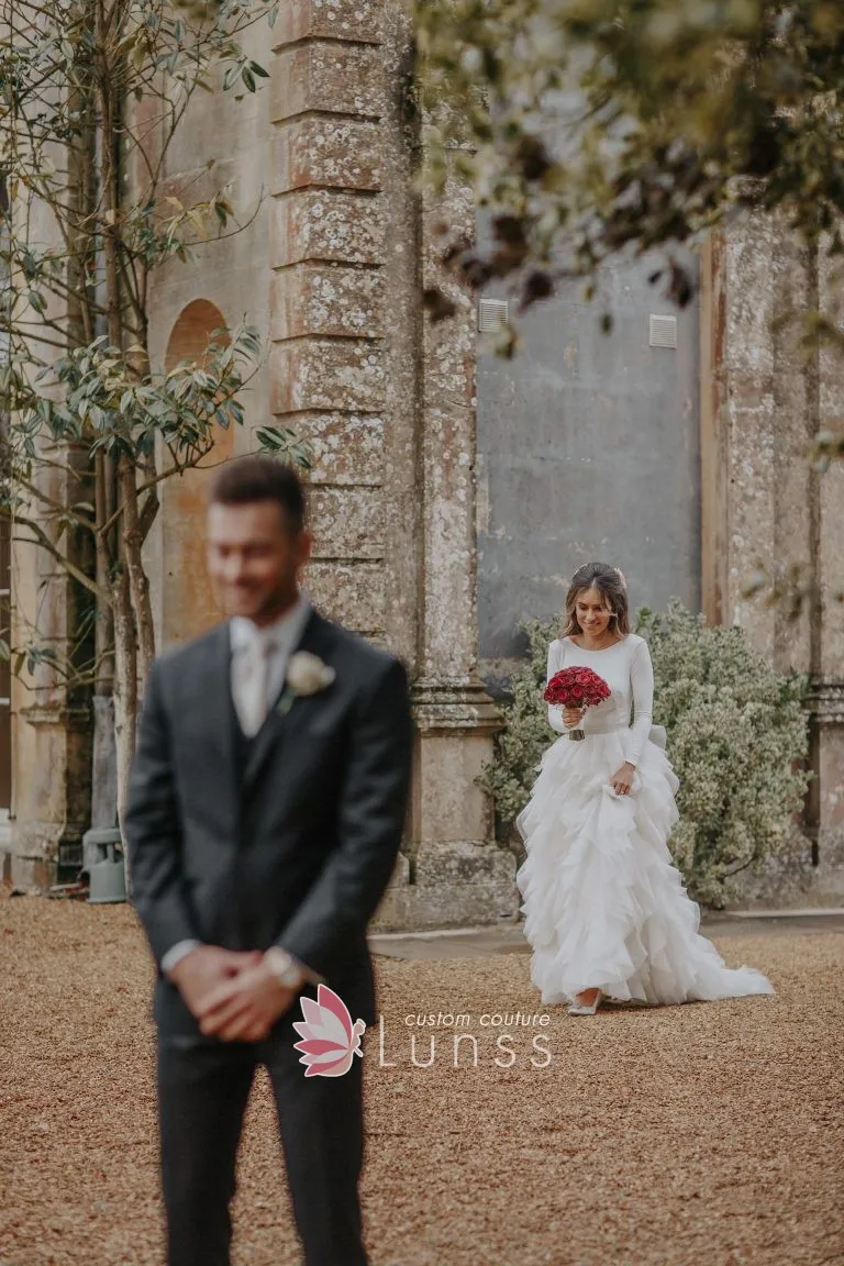 Alluring ivory jersey and ruffled organza long sleeve wedding dress