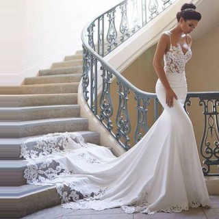 designer white lace and crepe mermaid wedding dress