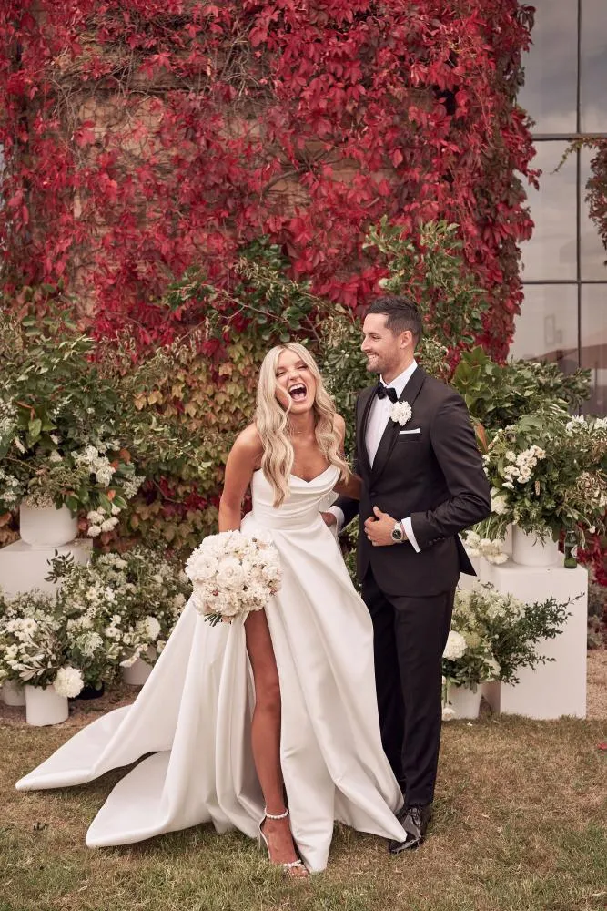 dramatic draped ivory satin slit wedding dress
