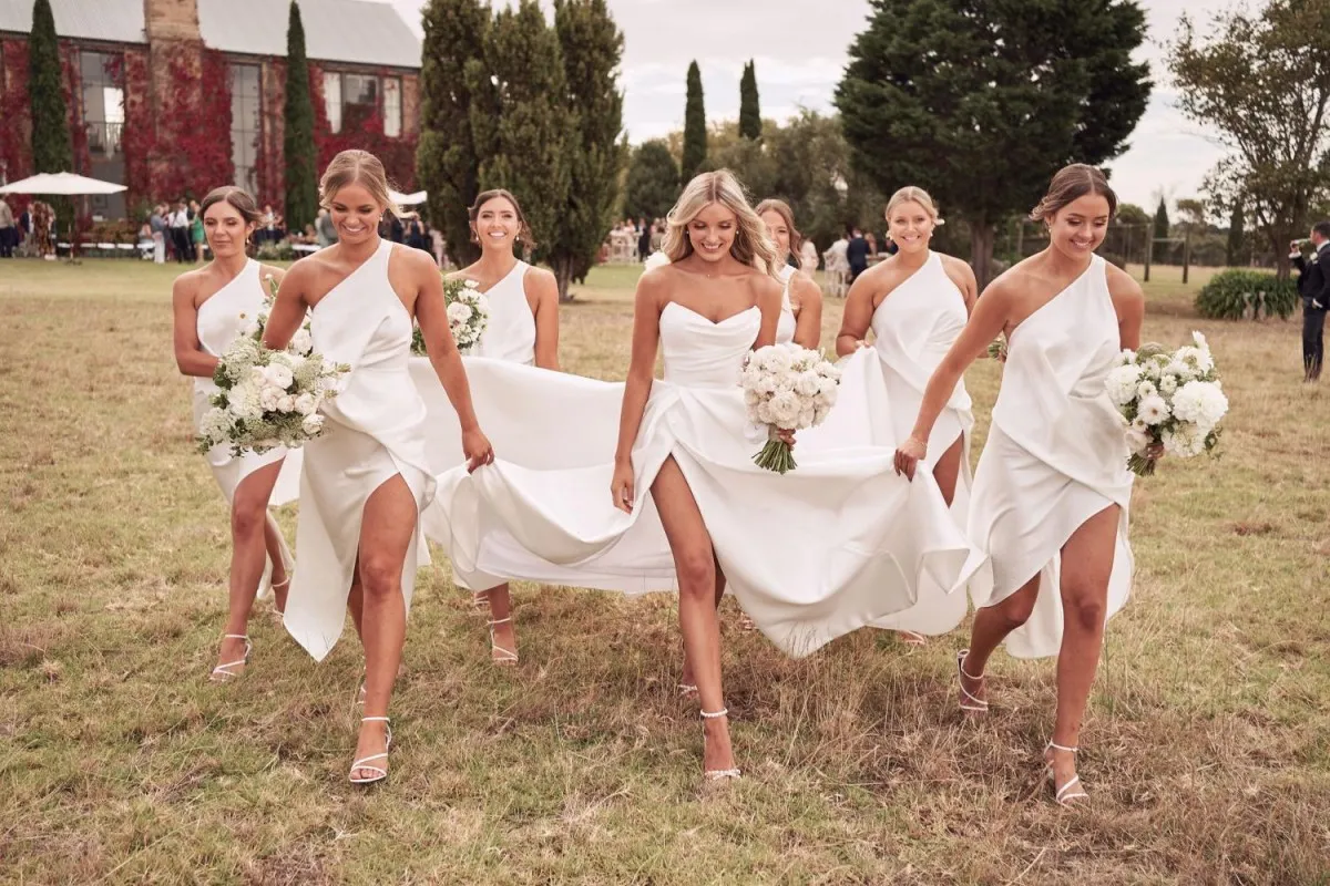 dramatic ivory white wedding dress and bridesmaid dresses