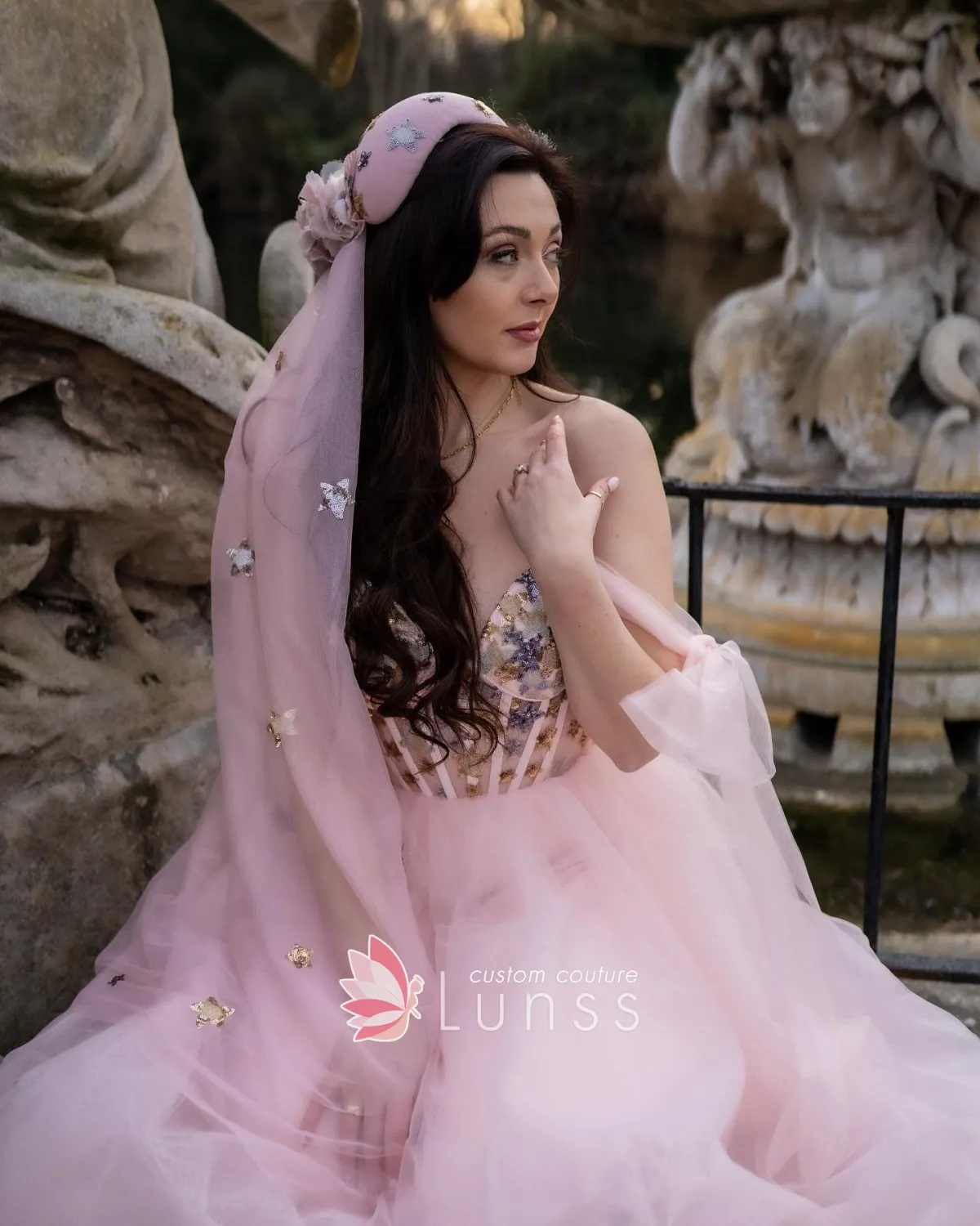 blushing pink tulle bridal dress with gold blue sequinned corset bodice