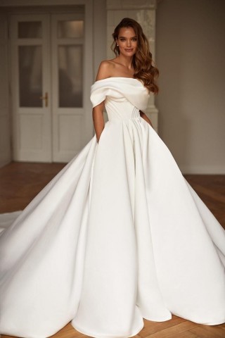 ivory draped matte satin off the shoulder bridal gown