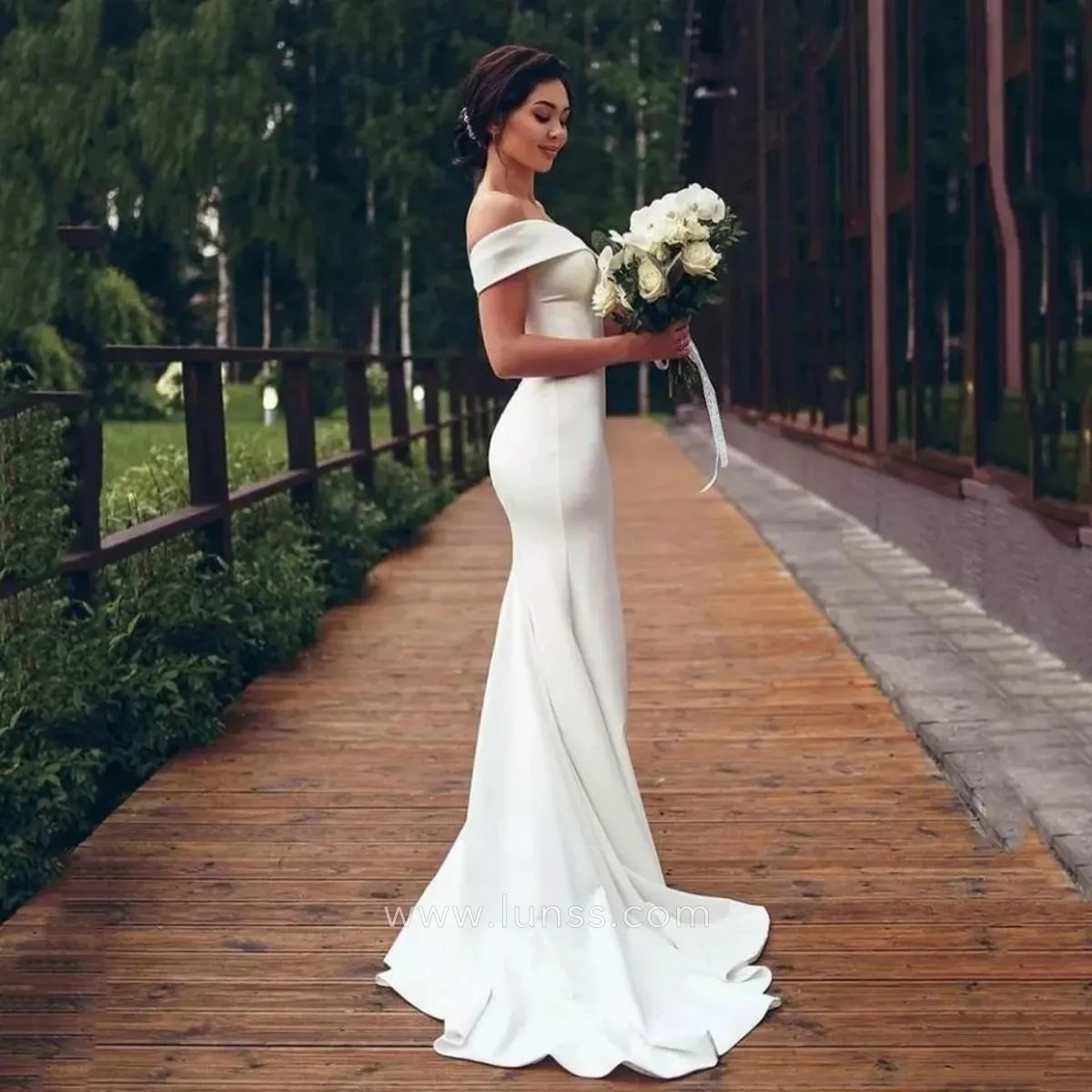 ivory satin off the shoulder mermaid bridal dress with a court train