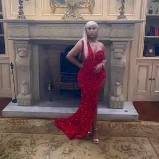 sexy boy hugging red sequin one shoulder split prom dress