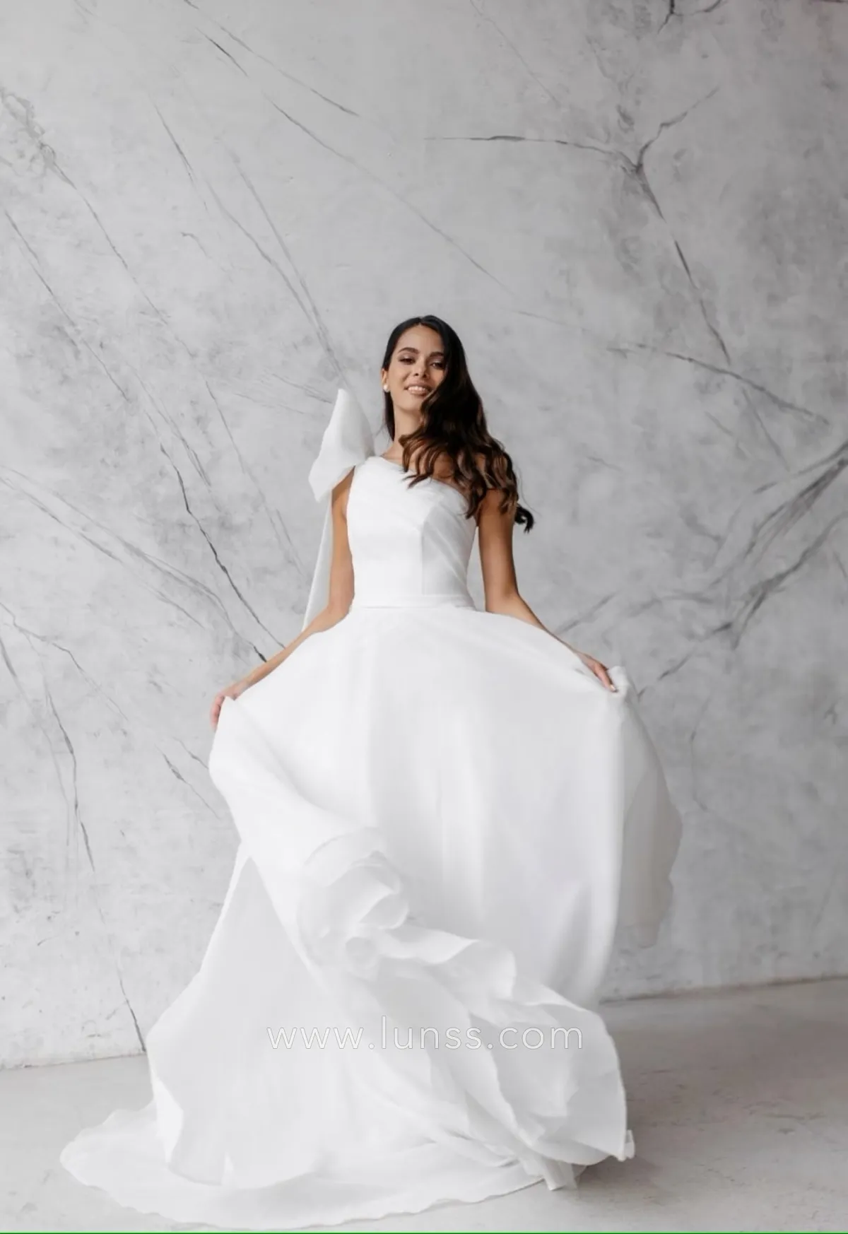 one shoulder floating strap wedding gown