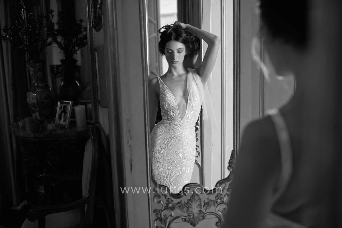 fitted sexy bridal dress features a daring plunging V neckline fitted sexy bridal dress features a daring plunging V neckline
