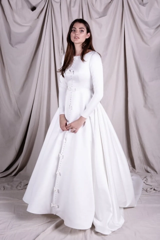 bows buttons embellished white satin wedding gown
