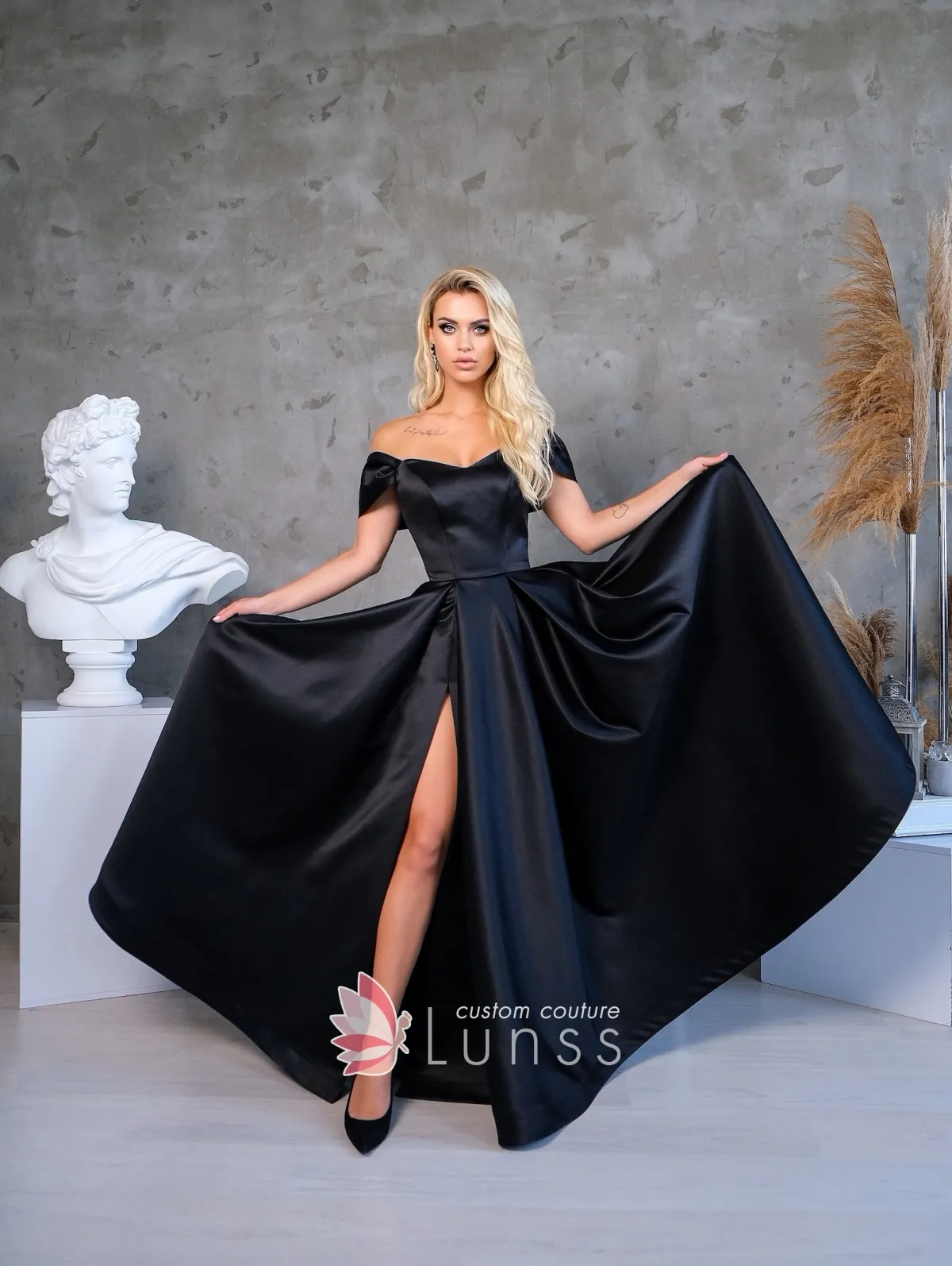 black sleek satin off shoulder A line long slit military ball dress
