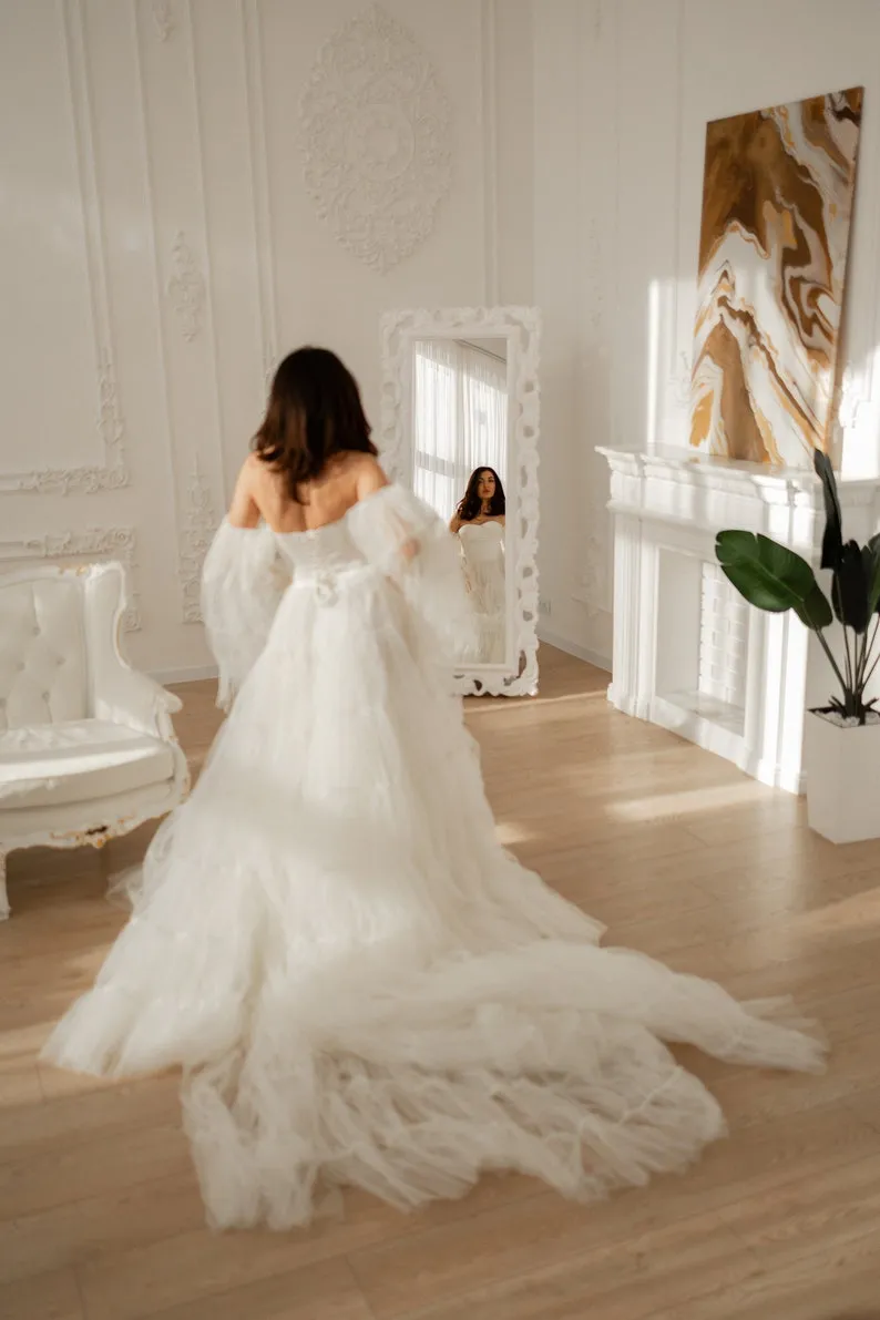 tiered tulle wedding dress with chapel train