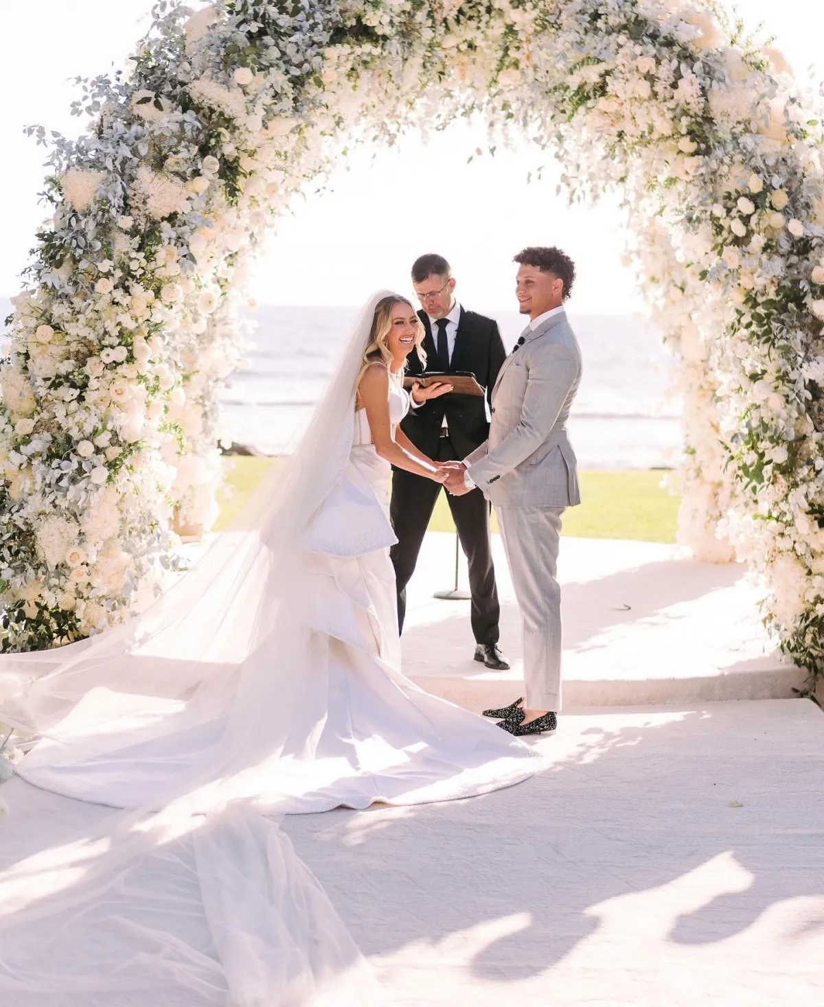 Brittany Mahomes layered log train wedding dress Brittany Mahomes layered log train wedding dress