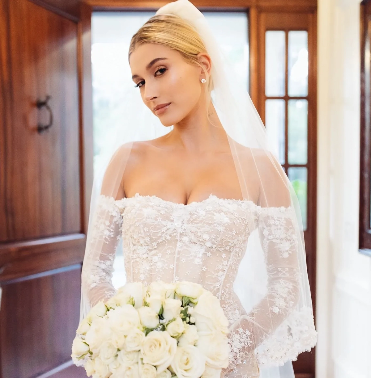 Hailey Bieber off shoulder lace long sleeve wedding gown