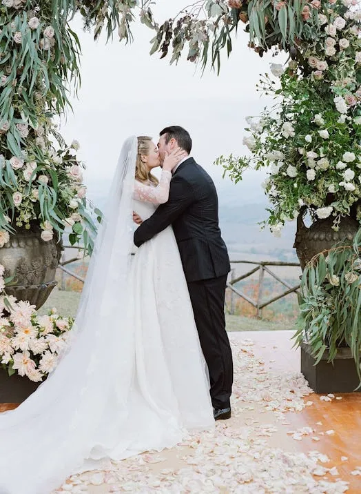 Kate Upton sheer lace long sleeve puffy wedding dress