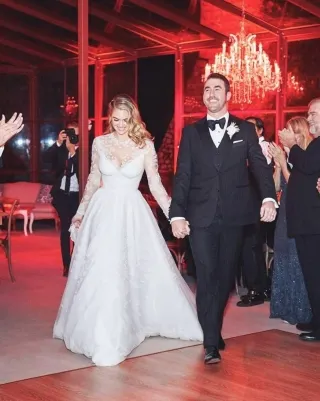 Kate Upton sheer lace v neck long sleeve wedding dress