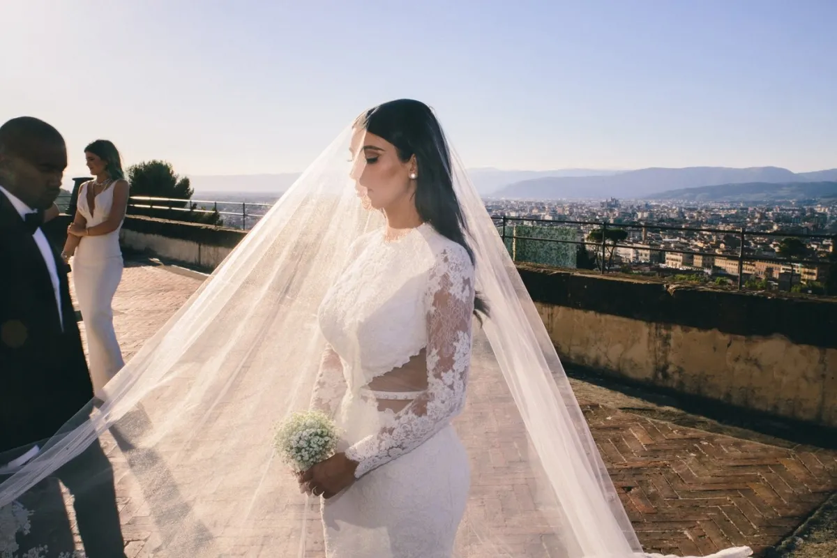 Kim Kardashian lace cutout wedding dress with sheer veil