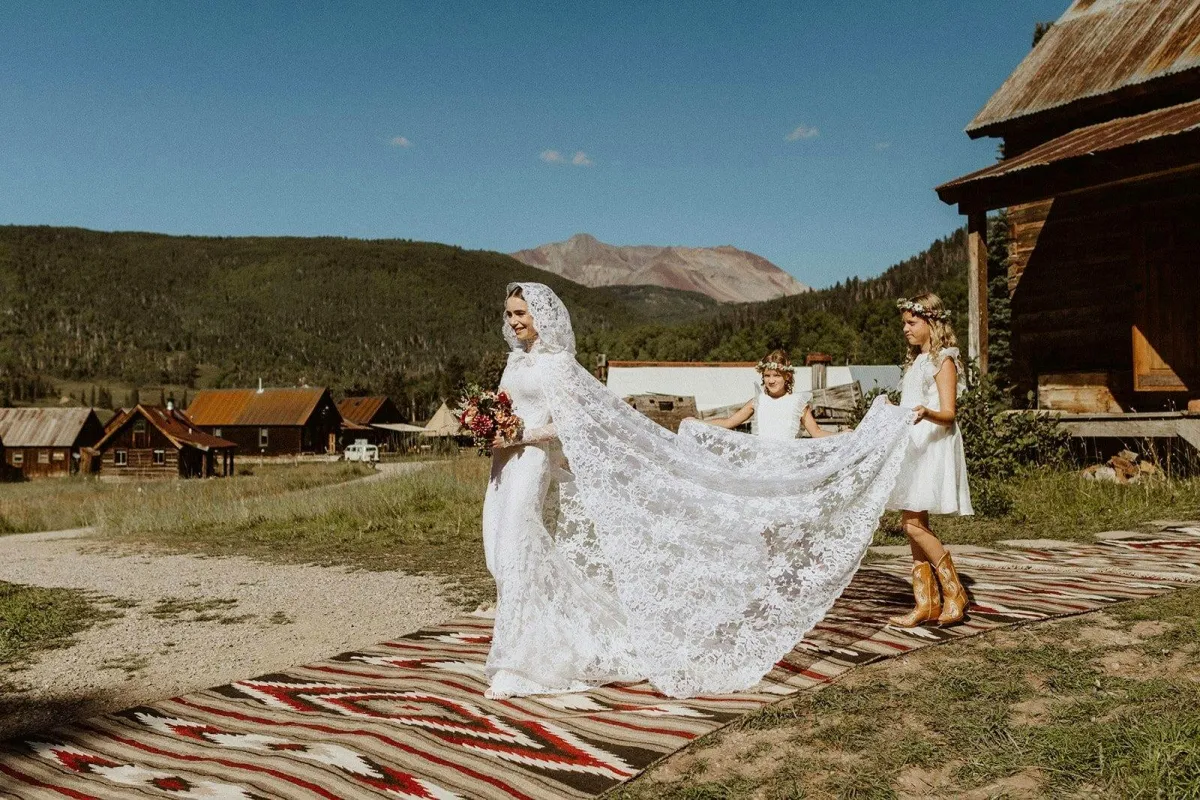 Lily Collins high neck lace bridal dress with cathedral length lace cape Lily Collins high neck lace bridal dress with cathedral length lace cape
