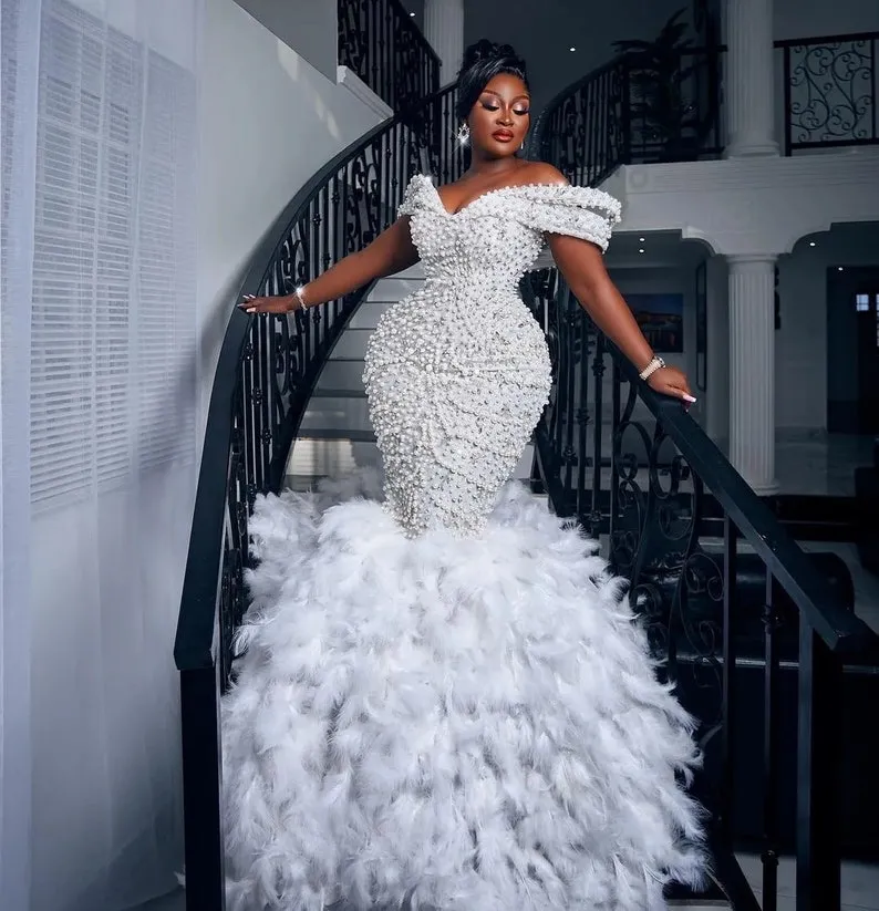 luxury pearls and feathers mermaid bridal gown