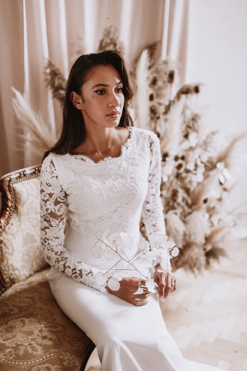 white lace and crepe long sleeve wedding dress