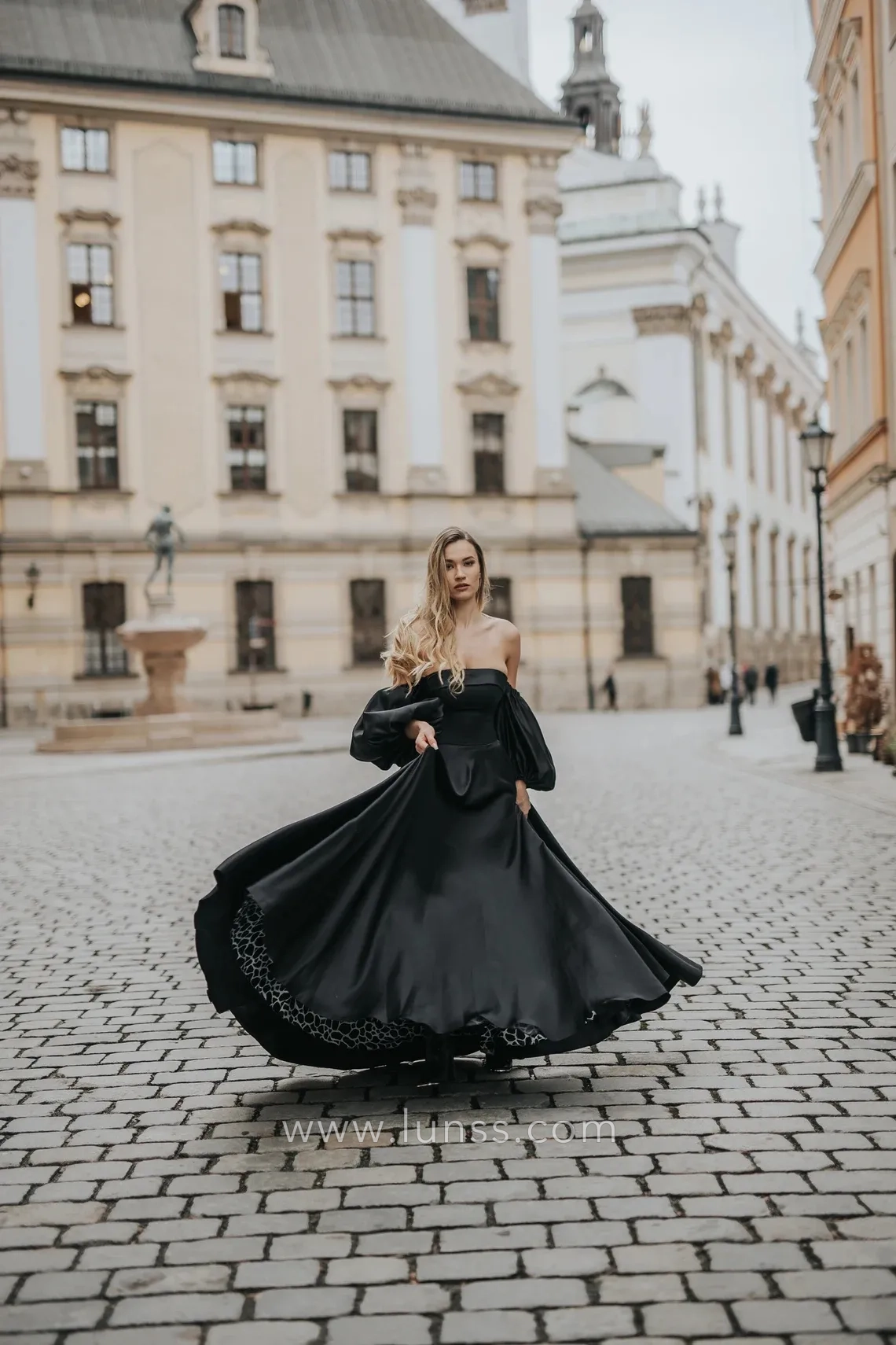 black satin strapless A line evening gown with puffy sleeves