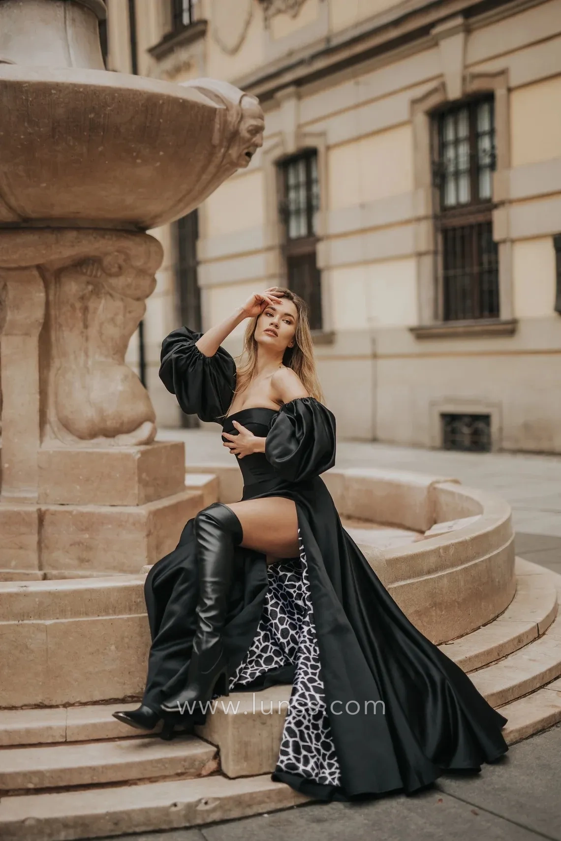 modern black satin evening gown with lantern sleeves