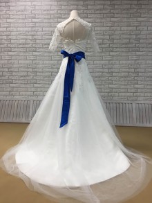 White fit and flare tulle wedding dress with royal blue sash