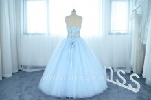 illusion strapless pearl layered tulle ball gown made in baby blue color