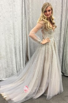 Designer wedding dress with sheer sleeves and pearls