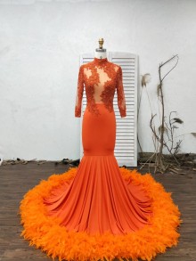 dark orange dress with feathers bottom