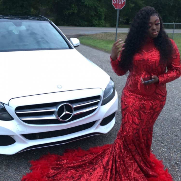custom made red sequin and feather long sleeve prom dress