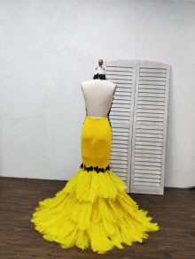 Halter black applique yellow feather open back mermaid prom gown