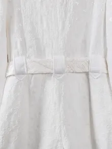 whtie romper with a belt