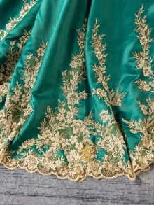 green with gold embroidery