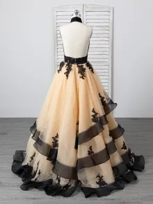 custom made black lace and champagne ruffled tulle prom gown