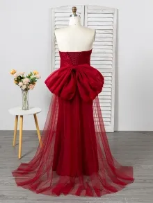 burgundy dress with a bow in the back
