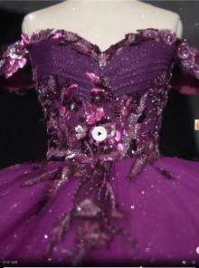 plum ballgown embelished with gems and flowers