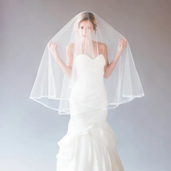 one tier fingertip length vintage ivory tulle bridal veil pencil edge