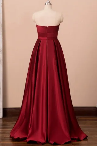dark red satin strapless A line long prom gown with pockets