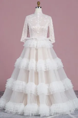 tiered tulle skirt pearls and rhinestones champagne gown