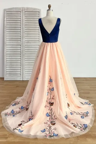 navy blue top and peach bottom designer formal dress with butterflies and peach blossom embellishment