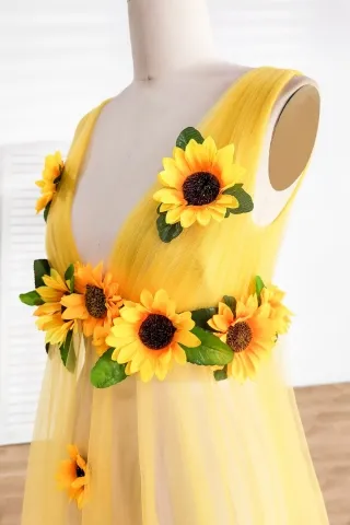 sleeveless plunging neck dress with sunflowers embellishment
