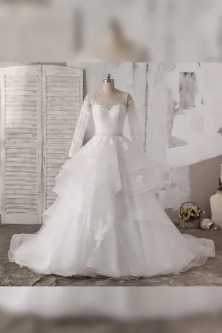pearled illusion long sleeve tiered bridal ball gown