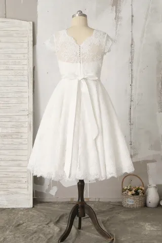 ivory illusion button back lace knee length a line bridal gown