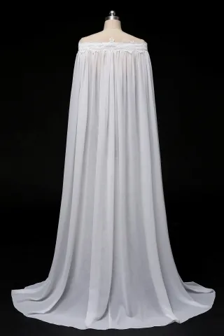 floor length ivory chiffon caped bridal gown