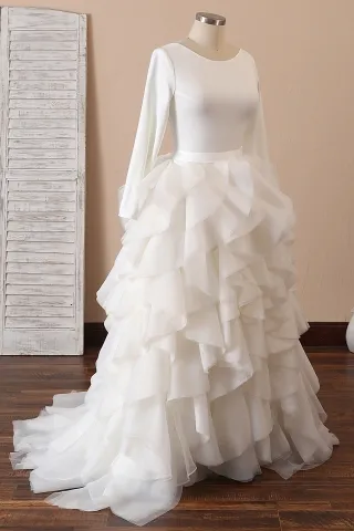 ivory jersey and organza long sleeve ruffled skirt bridal gown
