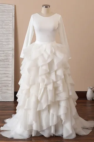 ivory jewel neck long sleeve ruffled organza bridal gown