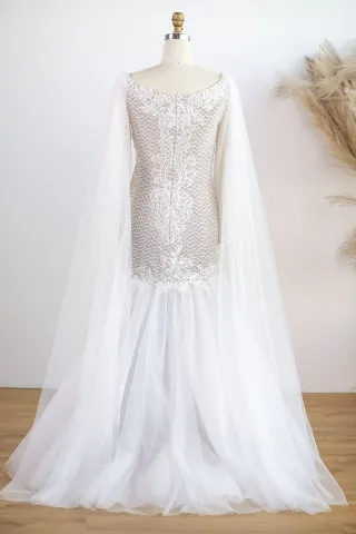 sheer long sleeve trumpet wedding gown with cape