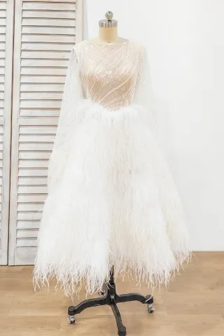 glistening sequin and feather tea length bridal dress