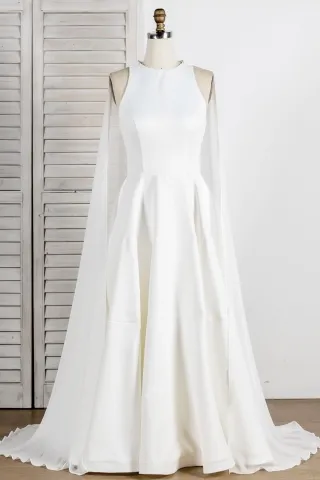 sleeveless ivory satin bridal dress with chiffon cape