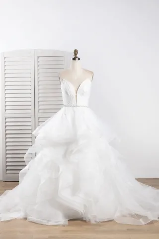 beaded strapless plunging neck flounced tulle bridal gown
