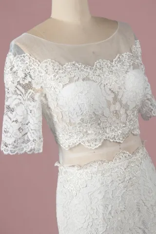 illusion neckline and half length sleeves wedding dress
