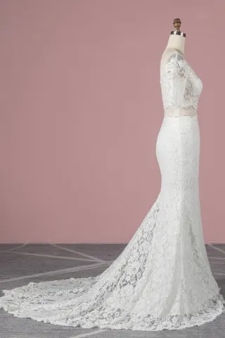 scalloped two piece ivory lace wedding gown with a court train
